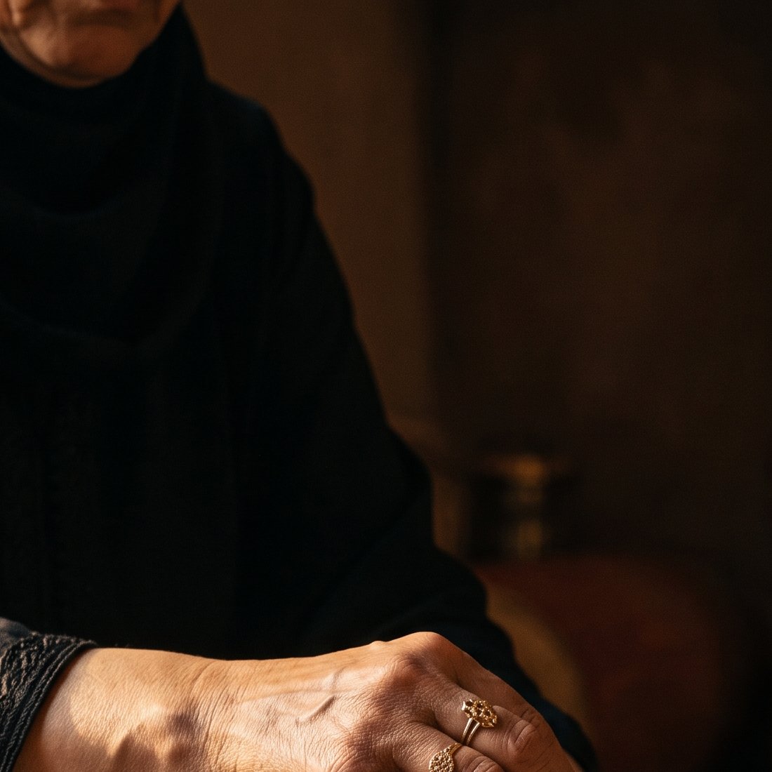 Woman preparing Lampidia argan oil with a traditional stone mortar